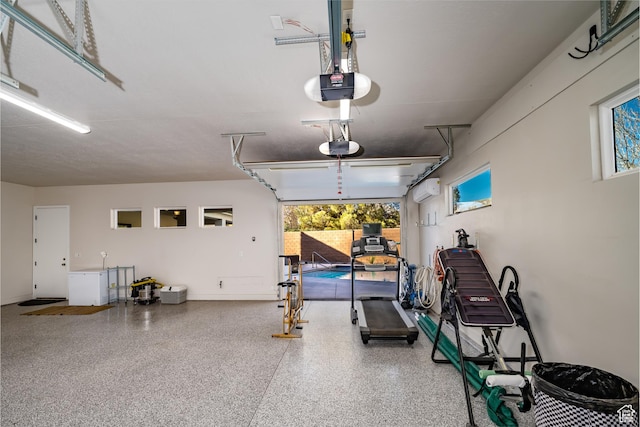 1283 N Gallen Rd W, Santa Clara, UT 84765 - garage featuring a garage door opener and a wall mounted air conditioner