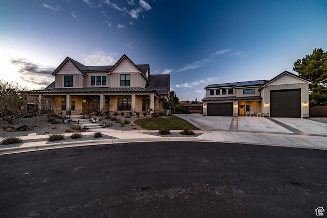 1283 N Gallen Rd W, Santa Clara, UT 84765 - view of front of home featuring solar panels, covered porch, and a garage