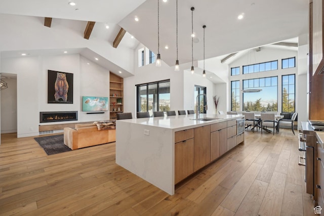 7242 Lupine Dr, Park City, UT 84098 - kitchen featuring open floor plan, a sink, modern cabinets, high vaulted ceiling, and beamed ceiling