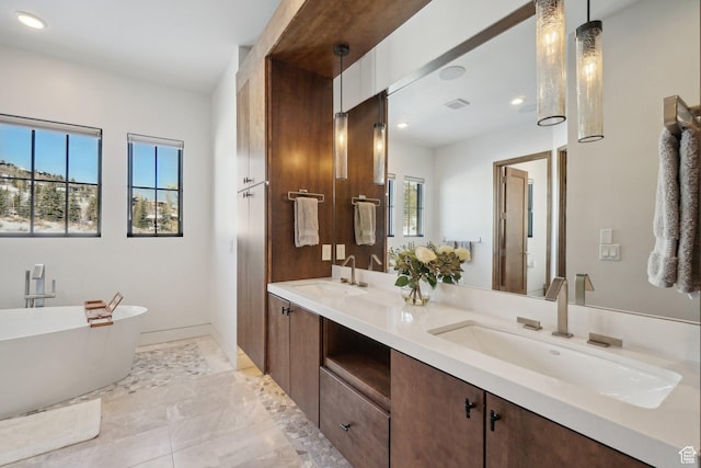 7242 Lupine Dr, Park City, UT 84098 - bathroom featuring double vanity, a freestanding bath, recessed lighting, and baseboards
