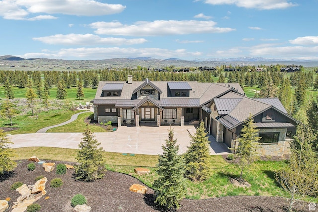 7242 Lupine Dr, Park City, UT 84098 - modern farmhouse style home featuring a standing seam roof, stone siding, a mountain view, and metal roof