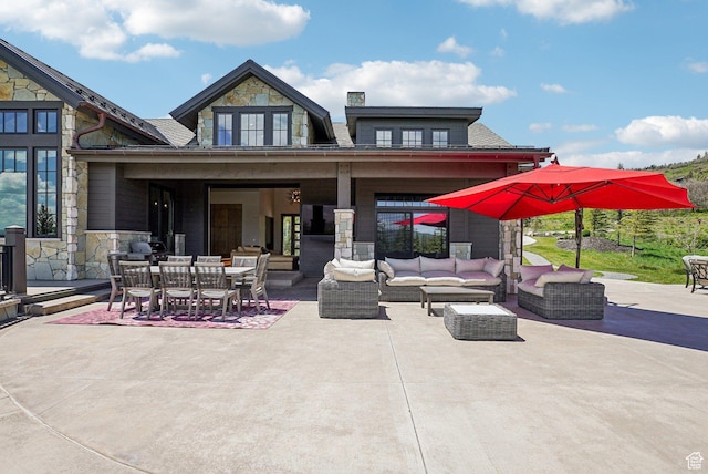 7242 Lupine Dr, Park City, UT 84098 - rear view of property with stone siding, an outdoor living space, a patio area, and outdoor dining space