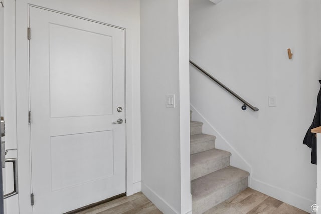 foyer entrance with light hardwood / wood-style flooring