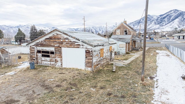 220 S Main St, Tooele, UT 84074 - exterior space featuring a garage, a mountain view, and an outdoor structure