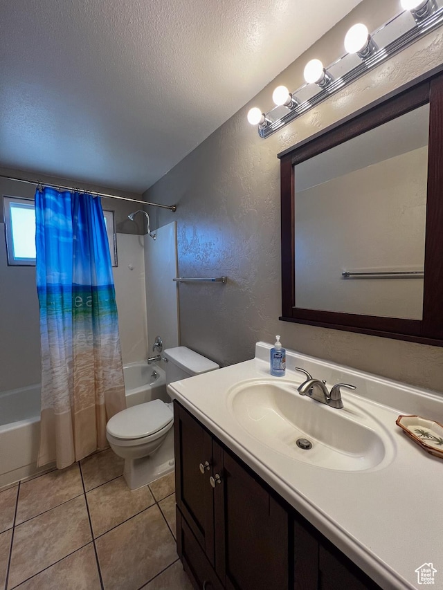 bathroom with tile patterned flooring, shower / tub combo, toilet, a textured wall, and a textured ceiling