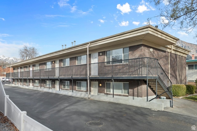 view of building exterior featuring a mountain view