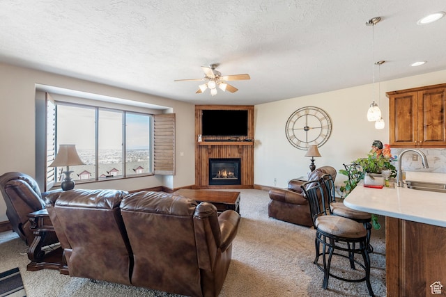 337 E Brayden Way, Draper, UT 84020 - carpeted living room with ceiling fan, a fireplace, sink, and a textured ceiling