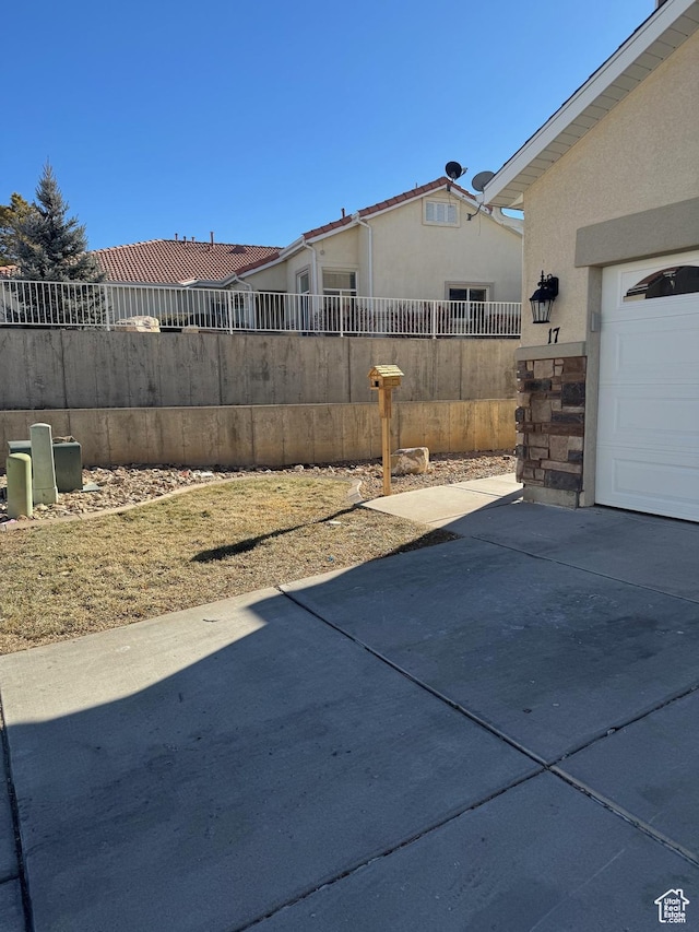 173 E Fidllers Canyon Rd Unit 17, Cedar City, UT 84721 - view of patio featuring fence