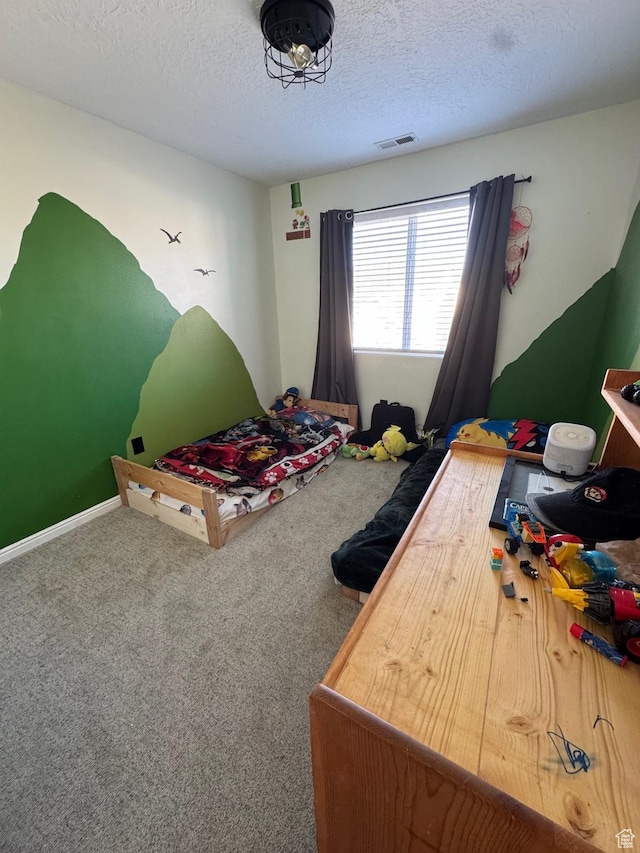 173 E Fidllers Canyon Rd Unit 17, Cedar City, UT 84721 - carpeted bedroom with visible vents and a textured ceiling