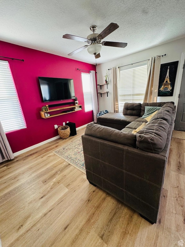 173 E Fidllers Canyon Rd Unit 17, Cedar City, UT 84721 - living area with a textured ceiling, wood finished floors, and an accent wall