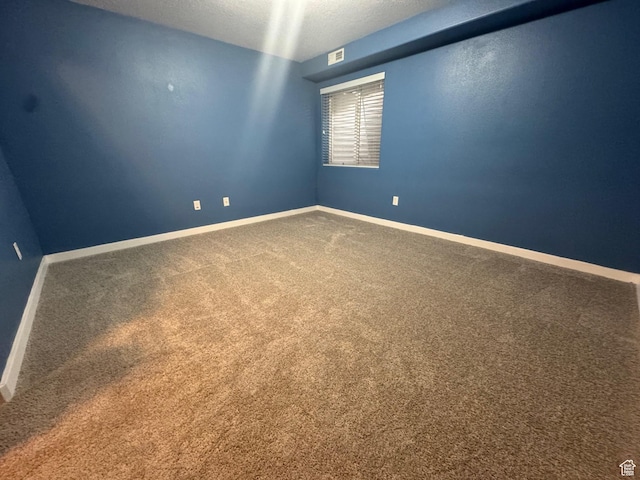 173 E Fidllers Canyon Rd Unit 17, Cedar City, UT 84721 - carpeted empty room with visible vents, baseboards, and a textured ceiling