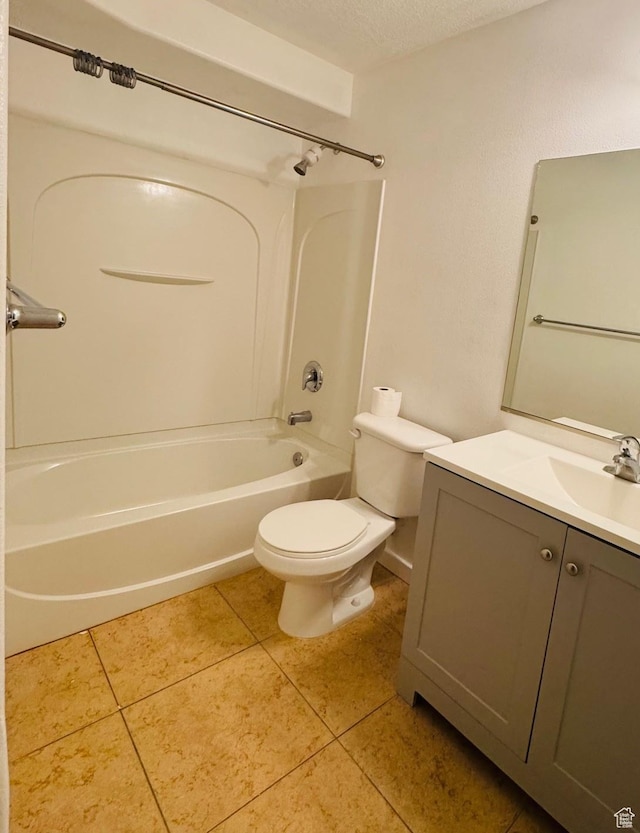 173 E Fidllers Canyon Rd Unit 17, Cedar City, UT 84721 - bathroom featuring vanity,  shower combination, tile patterned flooring, a textured ceiling, and toilet