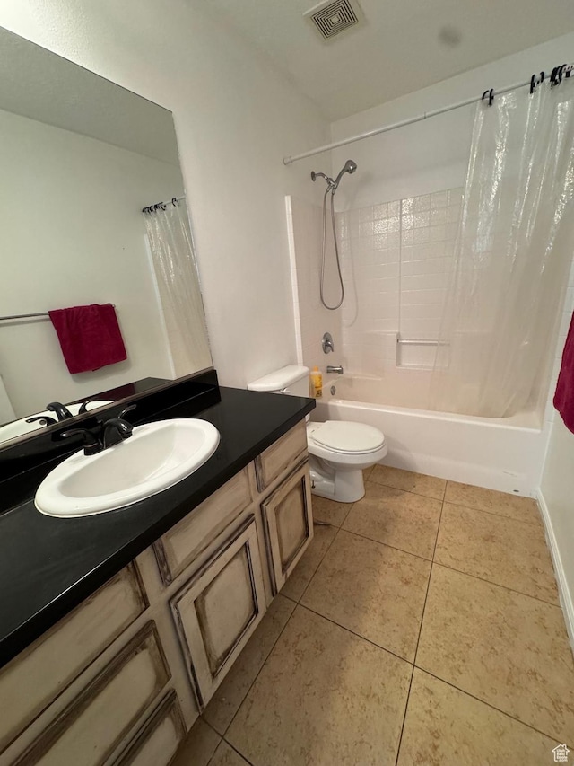 173 E Fidllers Canyon Rd Unit 17, Cedar City, UT 84721 - bathroom with visible vents, toilet, tile patterned floors, shower / bath combination with curtain, and vanity