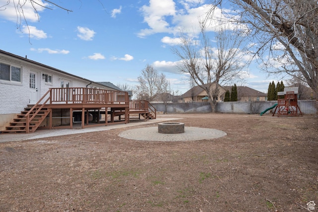 1455 E 100 S, Spanish Fork, UT 84660 - view of yard with a fire pit, a playground, fence, stairs, and a deck