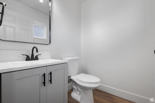1455 E 100 S, Spanish Fork, UT 84660 - half bathroom with baseboards, toilet, wood finished floors, and vanity
