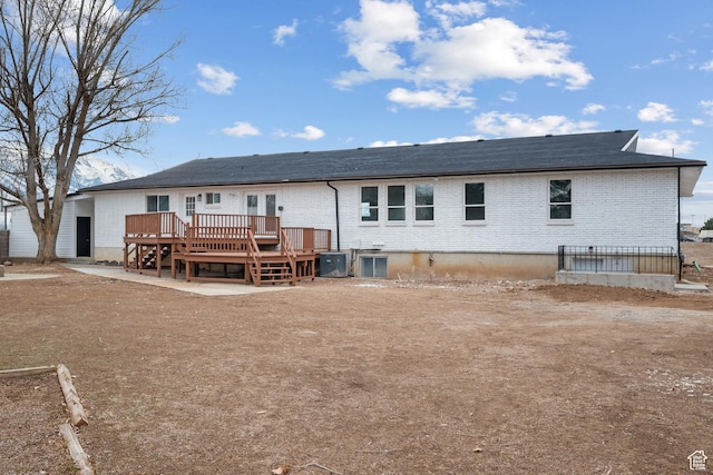 1455 E 100 S, Spanish Fork, UT 84660 - back of property featuring a deck, central air condition unit, and brick siding