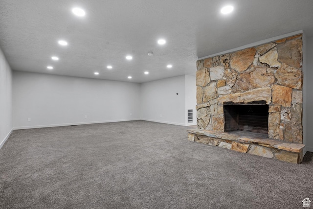 1455 E 100 S, Spanish Fork, UT 84660 - unfurnished living room with a stone fireplace, recessed lighting, a textured ceiling, and carpet