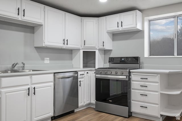 1455 E 100 S, Spanish Fork, UT 84660 - kitchen with a sink, stainless steel appliances, white cabinetry, and light countertops