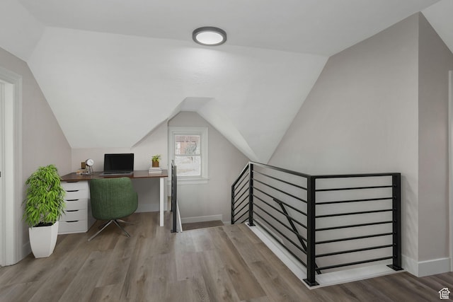 office space with lofted ceiling and light hardwood / wood-style flooring