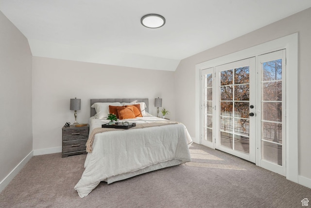 bedroom with lofted ceiling, light colored carpet, and access to outside