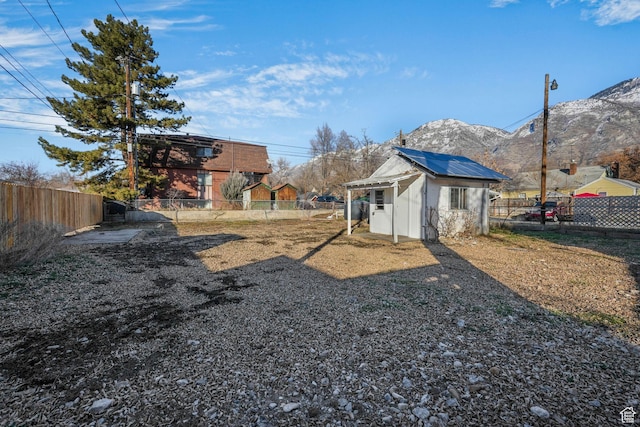 view of yard with an outbuilding and a mountain view