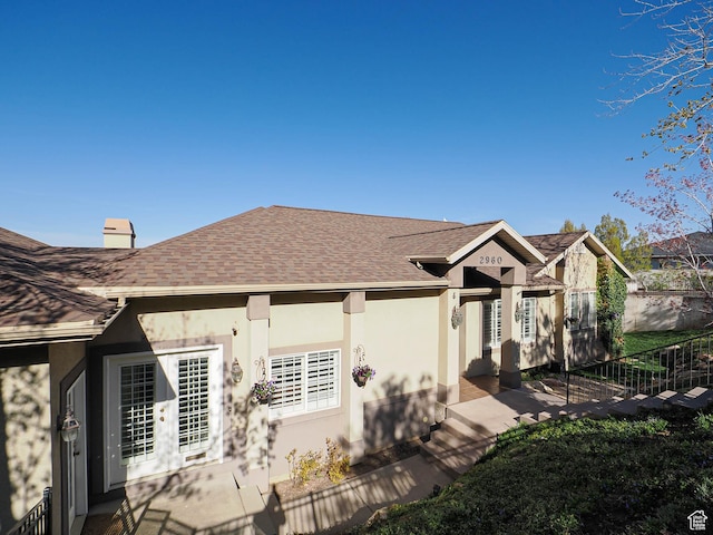 2960 E Oak Park Ln S, Holladay, UT 84117 - back of property featuring roof with shingles and stucco siding