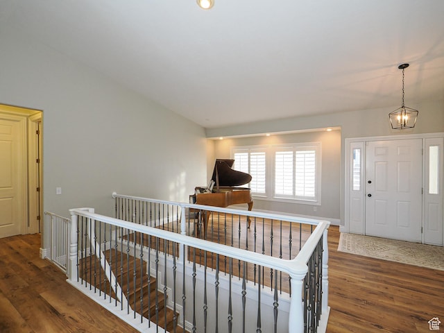 2960 E Oak Park Ln S, Holladay, UT 84117 - hallway featuring an upstairs landing, an inviting chandelier, and wood finished floors