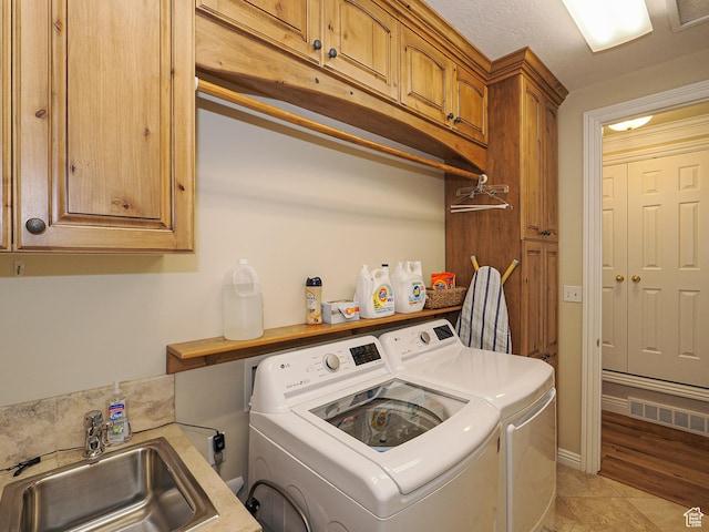 2960 E Oak Park Ln S, Holladay, UT 84117 - clothes washing area featuring cabinet space, visible vents, separate washer and dryer, and a sink