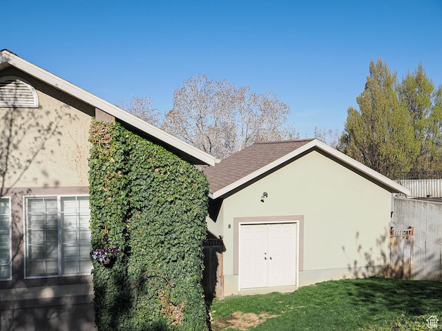 2960 E Oak Park Ln S, Holladay, UT 84117 - exterior space featuring a shingled roof, stucco siding, and a lawn