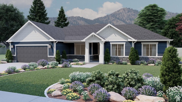 view of front of property with a front lawn, a mountain view, and a garage