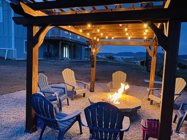 37 Wedge Way, Garden City, UT 84028 - view of patio / terrace featuring a mountain view and a fire pit