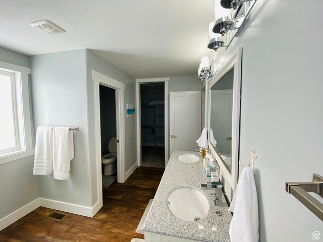 37 Wedge Way, Garden City, UT 84028 - bathroom featuring hardwood / wood-style flooring, a wealth of natural light, toilet, and vanity