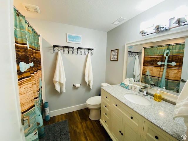 37 Wedge Way, Garden City, UT 84028 - bathroom featuring hardwood / wood-style floors, toilet, and vanity