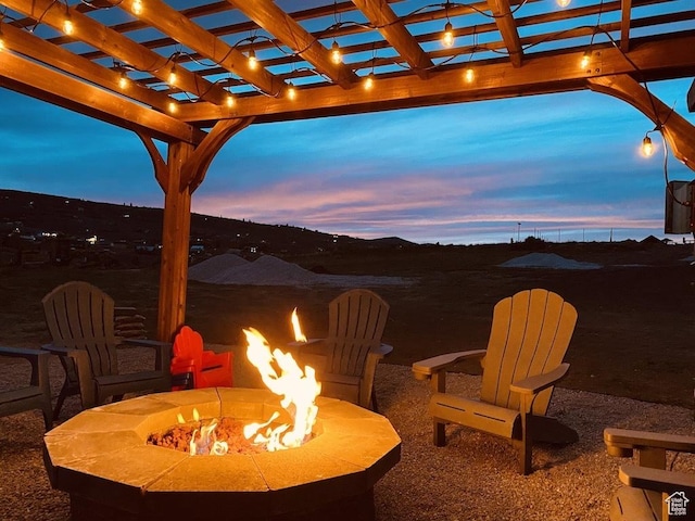 37 Wedge Way, Garden City, UT 84028 - patio terrace at dusk featuring an outdoor fire pit