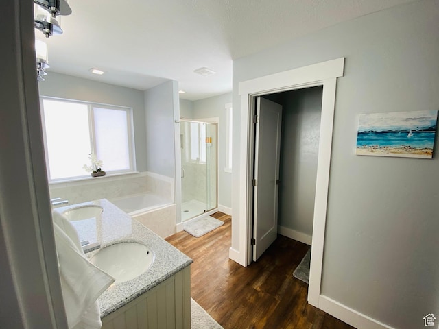 37 Wedge Way, Garden City, UT 84028 - bathroom featuring hardwood / wood-style floors, vanity, and independent shower and bath