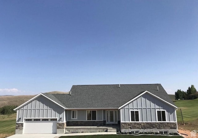 view of front facade with a front lawn and a garage