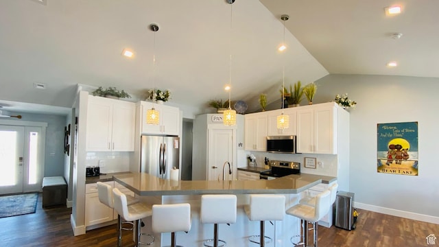 37 Wedge Way, Garden City, UT 84028 - kitchen with decorative light fixtures, white cabinetry, and stainless steel appliances