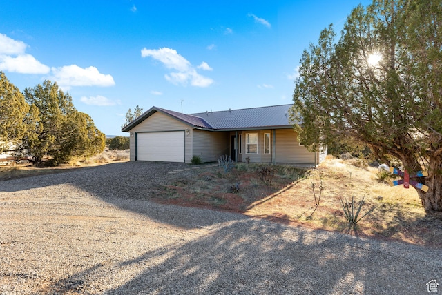ranch-style home featuring a garage
