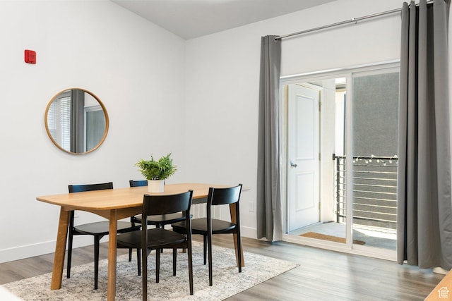 460 W 15 S Unit G301, Providence, UT 84332 - dining space featuring wood finished floors and baseboards