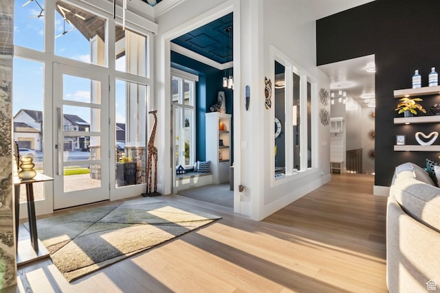 interior space featuring wood-type flooring and a high ceiling