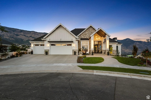 craftsman-style home with a mountain view and a garage