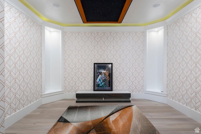 room details with wood-type flooring and ornamental molding