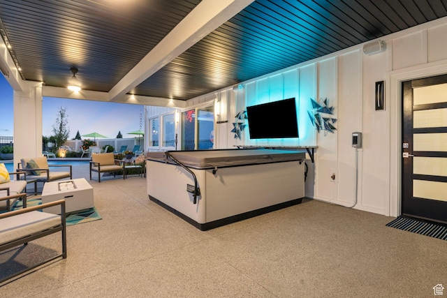 exterior space featuring outdoor lounge area and a hot tub