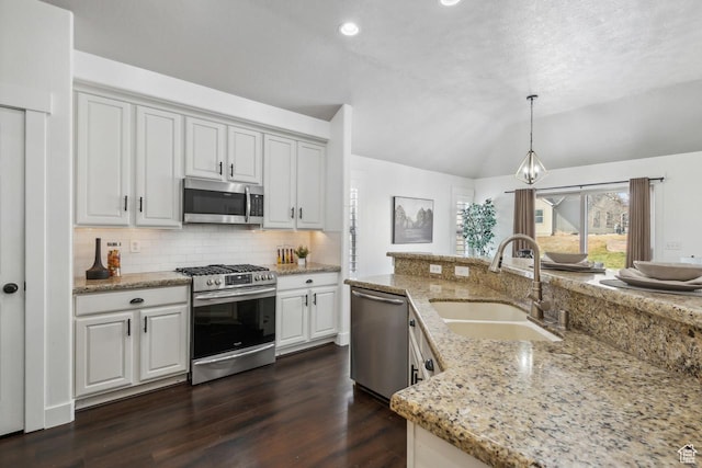6228 W Apollo Way, Highland, UT 84003 - kitchen featuring decorative light fixtures, sink, white cabinetry, light stone countertops, and appliances with stainless steel finishes