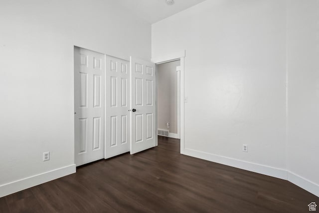 6228 W Apollo Way, Highland, UT 84003 - unfurnished bedroom with dark hardwood / wood-style floors and a closet