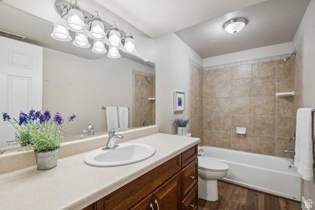 6228 W Apollo Way, Highland, UT 84003 - full bathroom with toilet, vanity, tiled shower / bath, and hardwood / wood-style floors