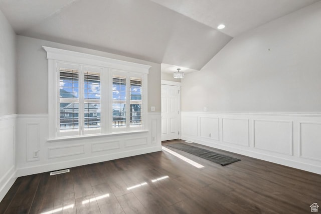 6228 W Apollo Way, Highland, UT 84003 - spare room with vaulted ceiling, dark hardwood / wood-style flooring, and an inviting chandelier