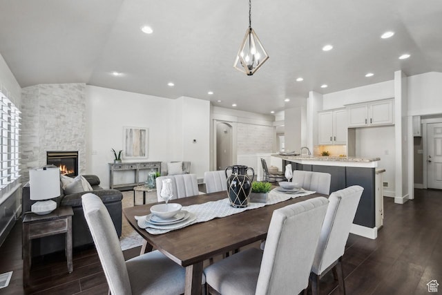 6228 W Apollo Way, Highland, UT 84003 - dining space with dark hardwood / wood-style floors, a stone fireplace, and sink