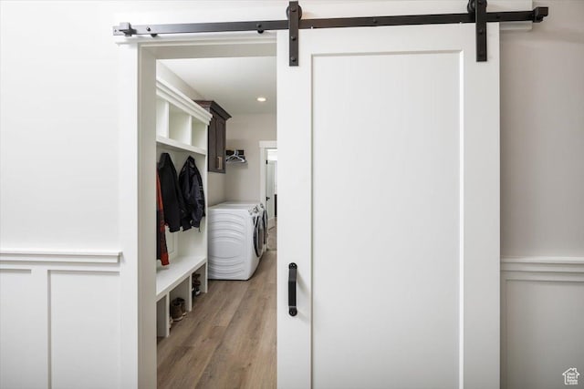 mudroom featuring washer and dryer and hardwood / wood-style flooring