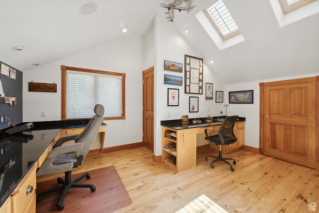 1 Spyglass Ct, Park City, UT 84060 - office space with lofted ceiling with skylight, built in desk, and light hardwood / wood-style flooring
